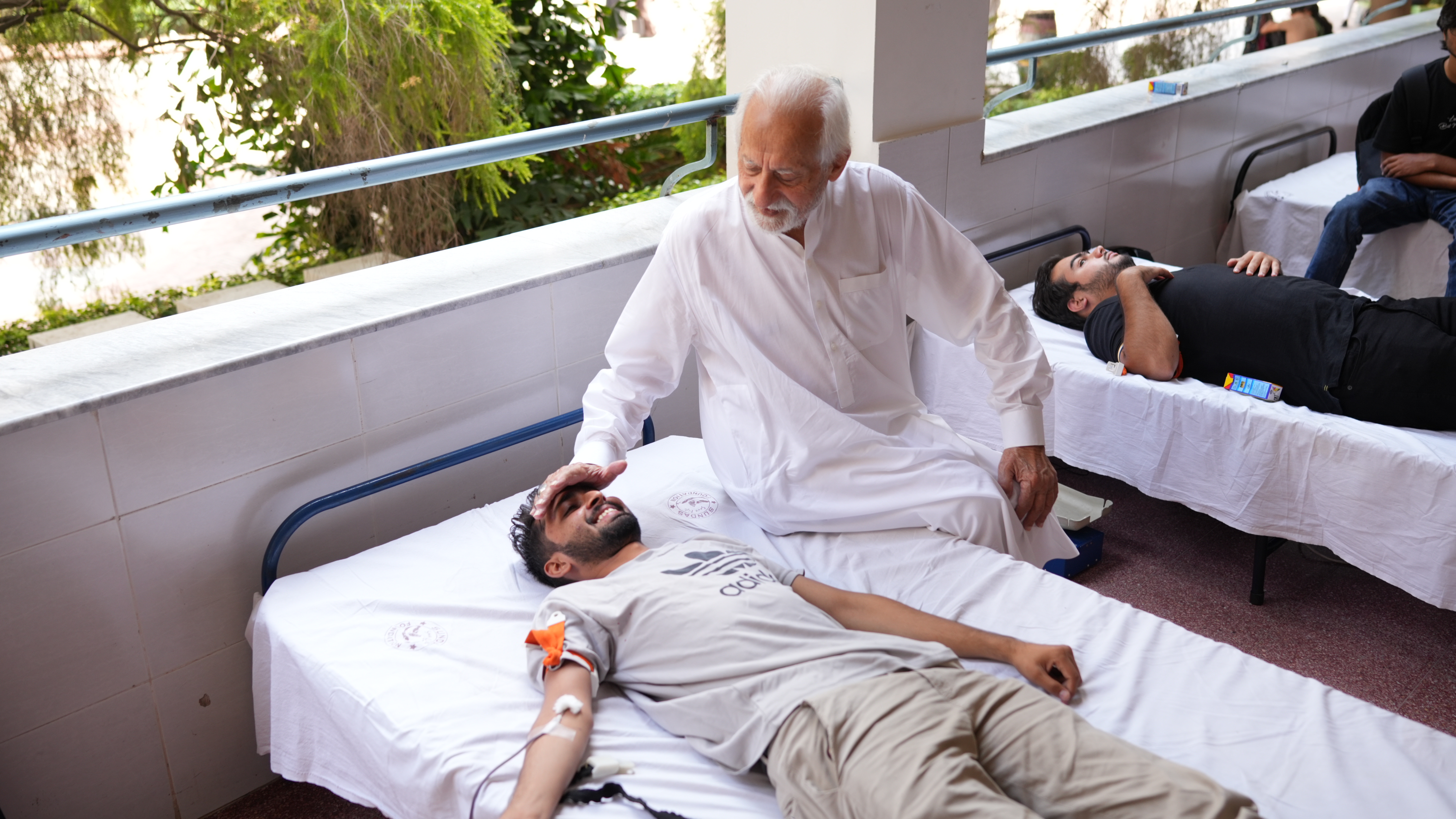 Students donating blood at Sundas Foundation's camp at University of Lahore to support thalassemia and hemophilia patients