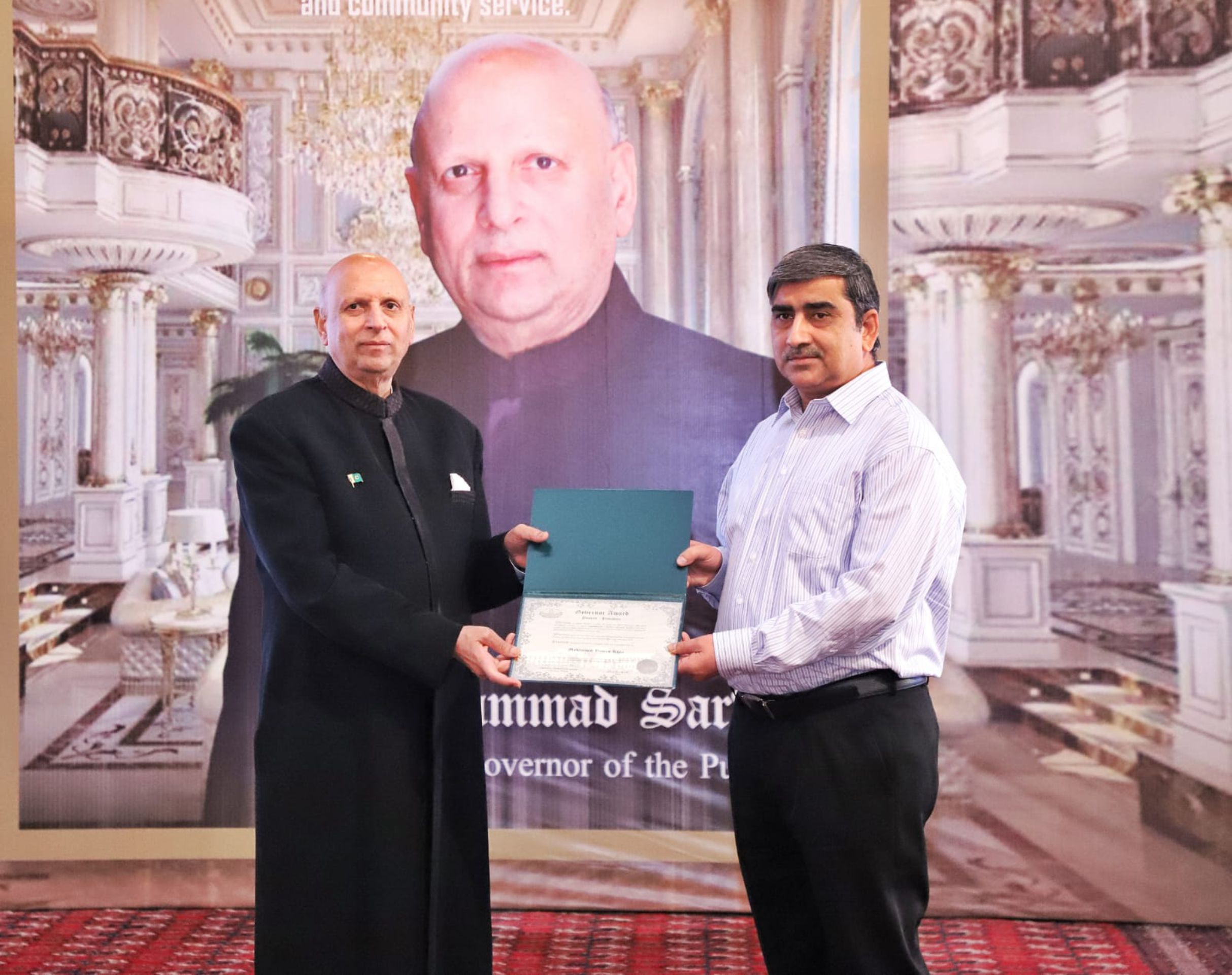 Receiving a award from Governor Punjab